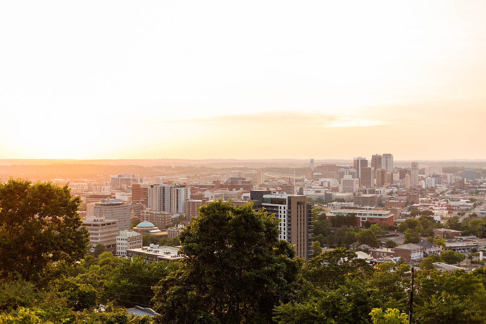 A landscape portrait of the city of Birmingham, AL at sunset. 