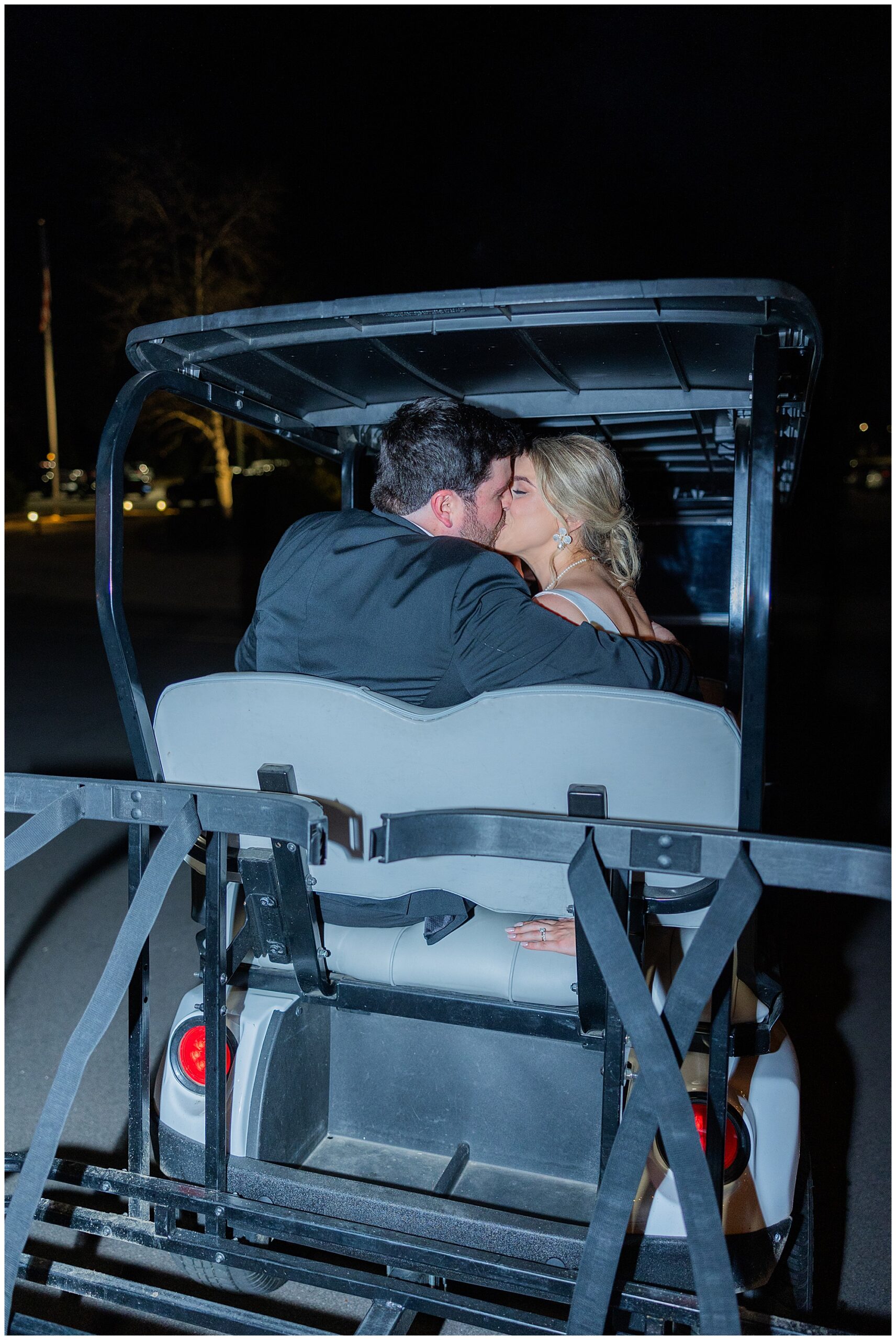 James and Faith share a kiss as they drive away on the golf cart. 